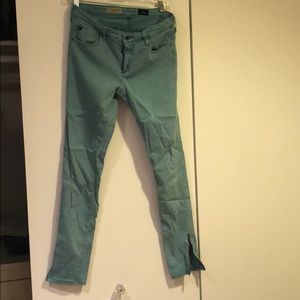 AG turquoise skinny leg zipper bottom jeans
